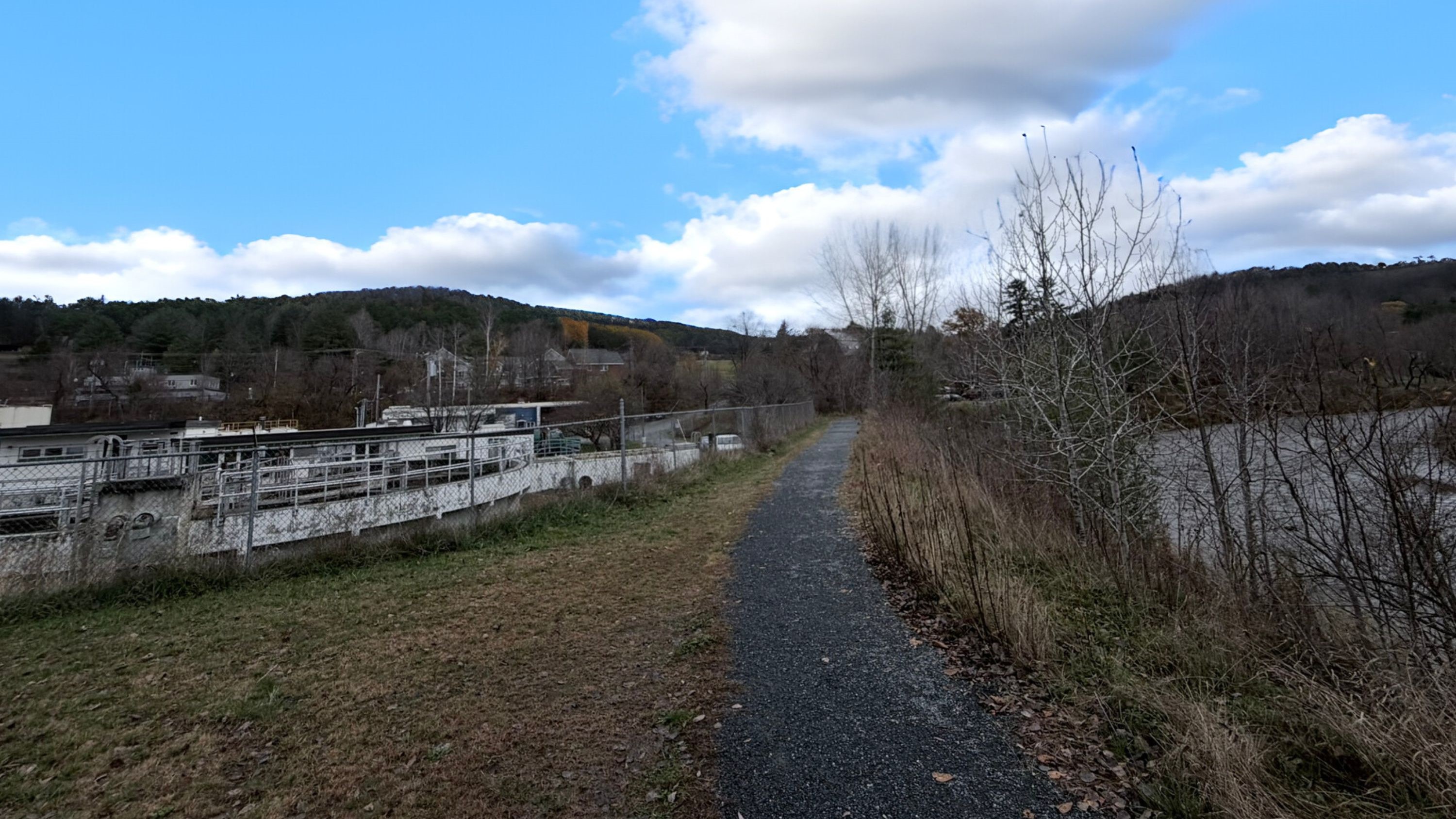 Photos showing the proximity of the river to the wastewater treatment facility